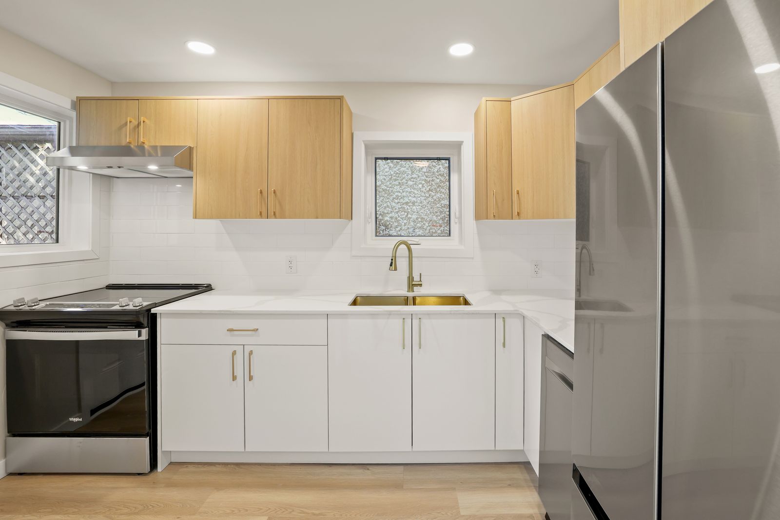 Kitchen with quartz counters and brushed gold fixtures